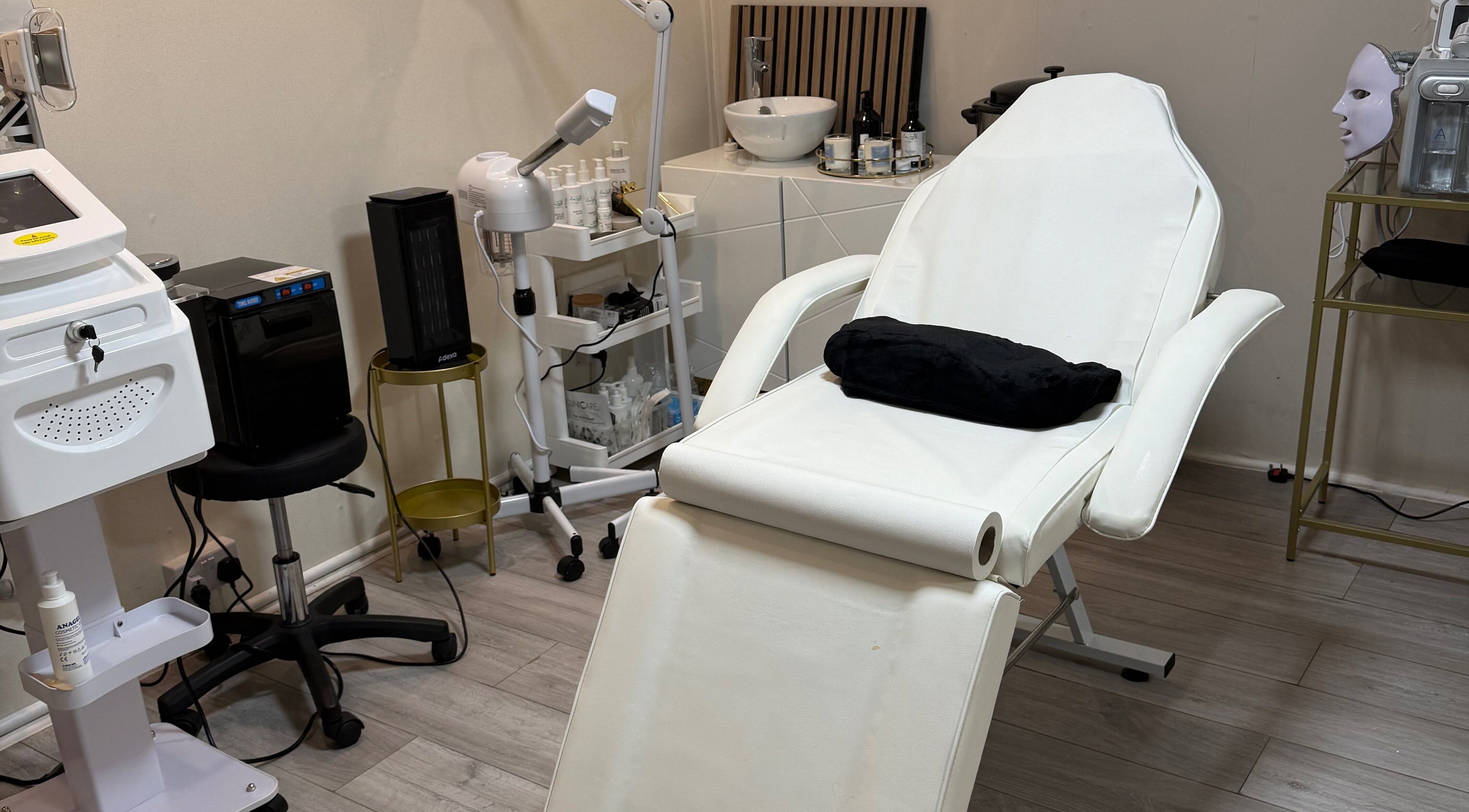 Ndila Beauty Academy's tranquil treatment room in Manchester, England, GB, featuring a comfortable spa chair.