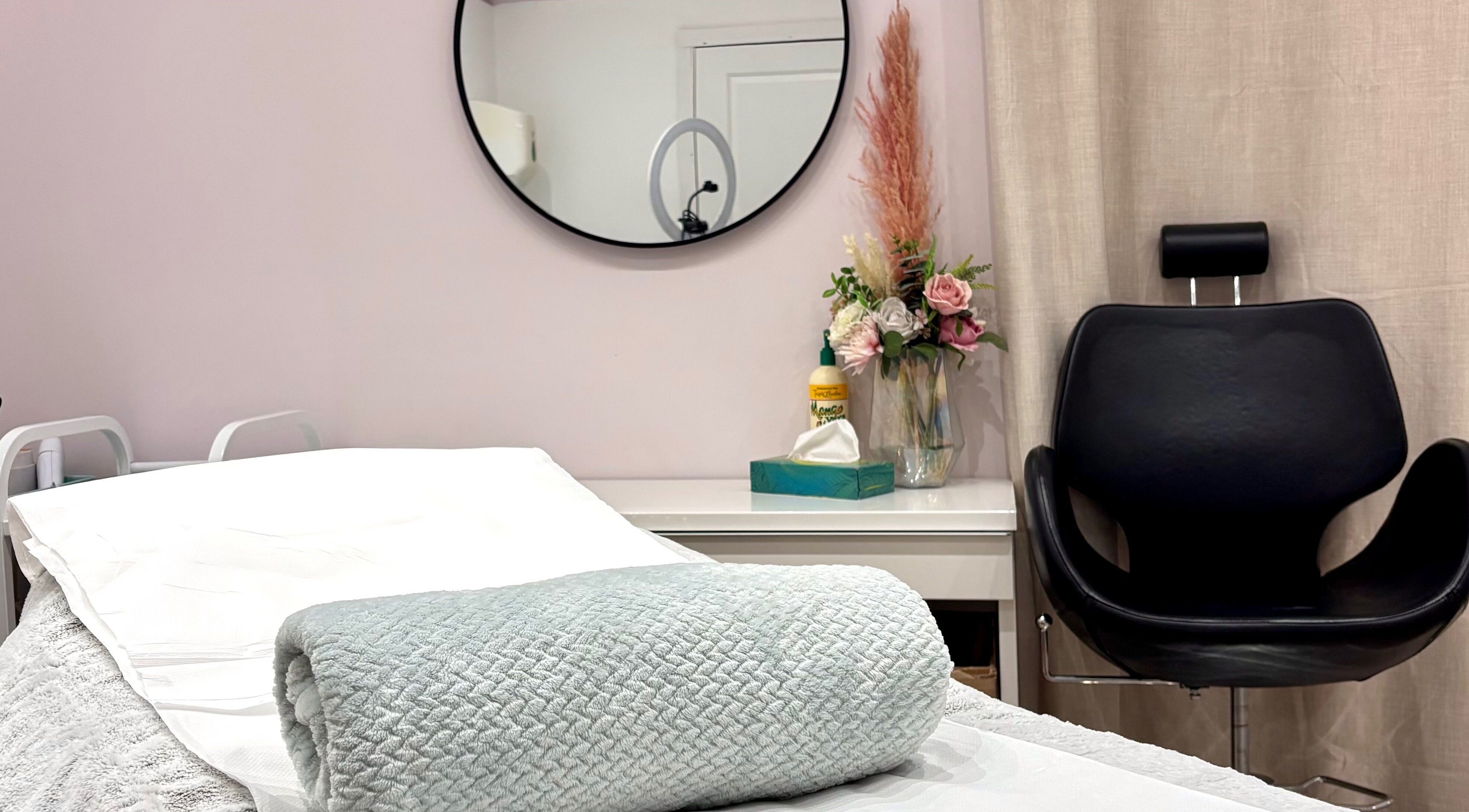 Relaxing treatment room at Gemma Binskin Beauty, Canterbury, England, GB. Cozy setup with chair and decor.