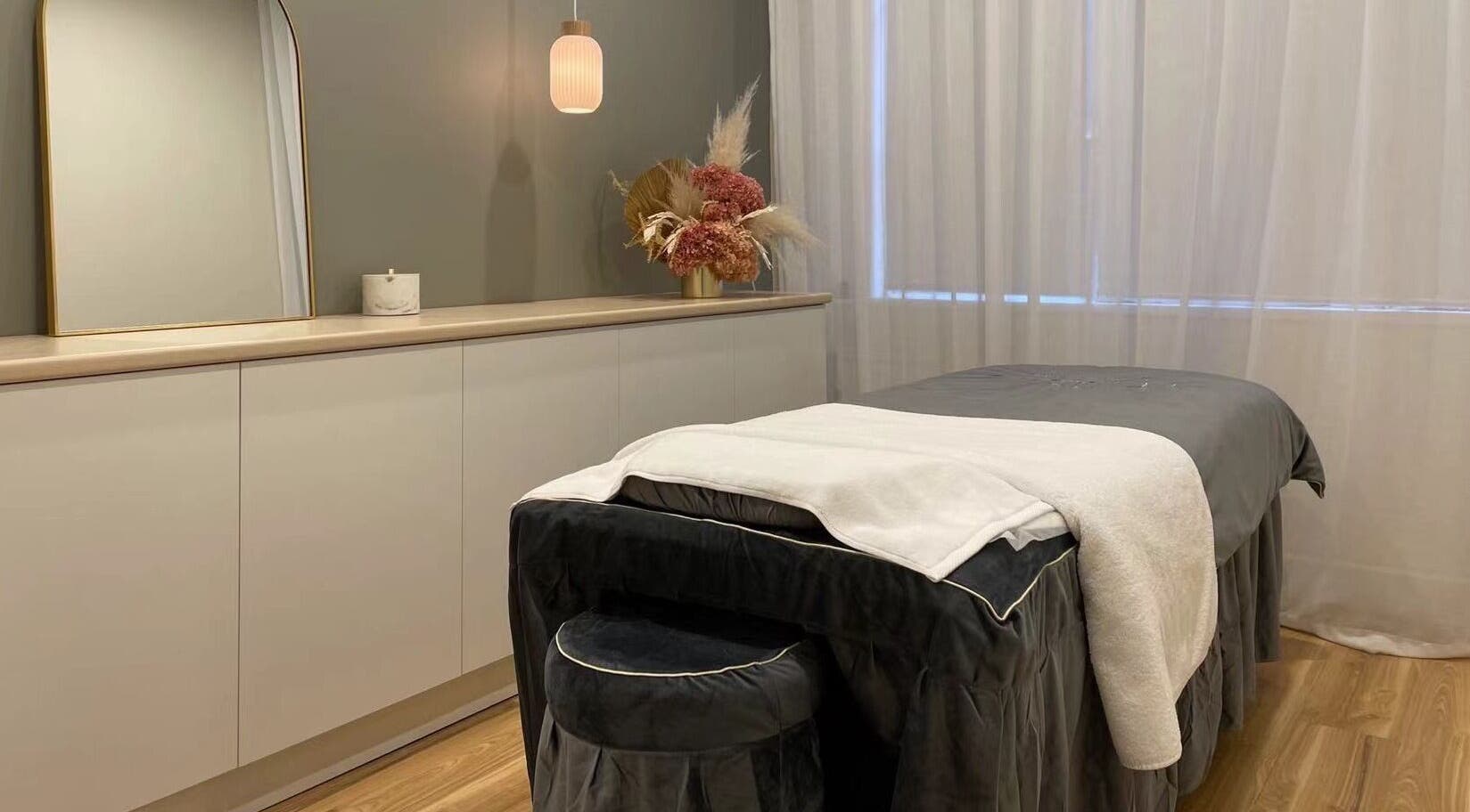 A tranquil treatment room at Cica Skin Care, Sydney, New South Wales, AU with massage bed, soft lighting, and decor.