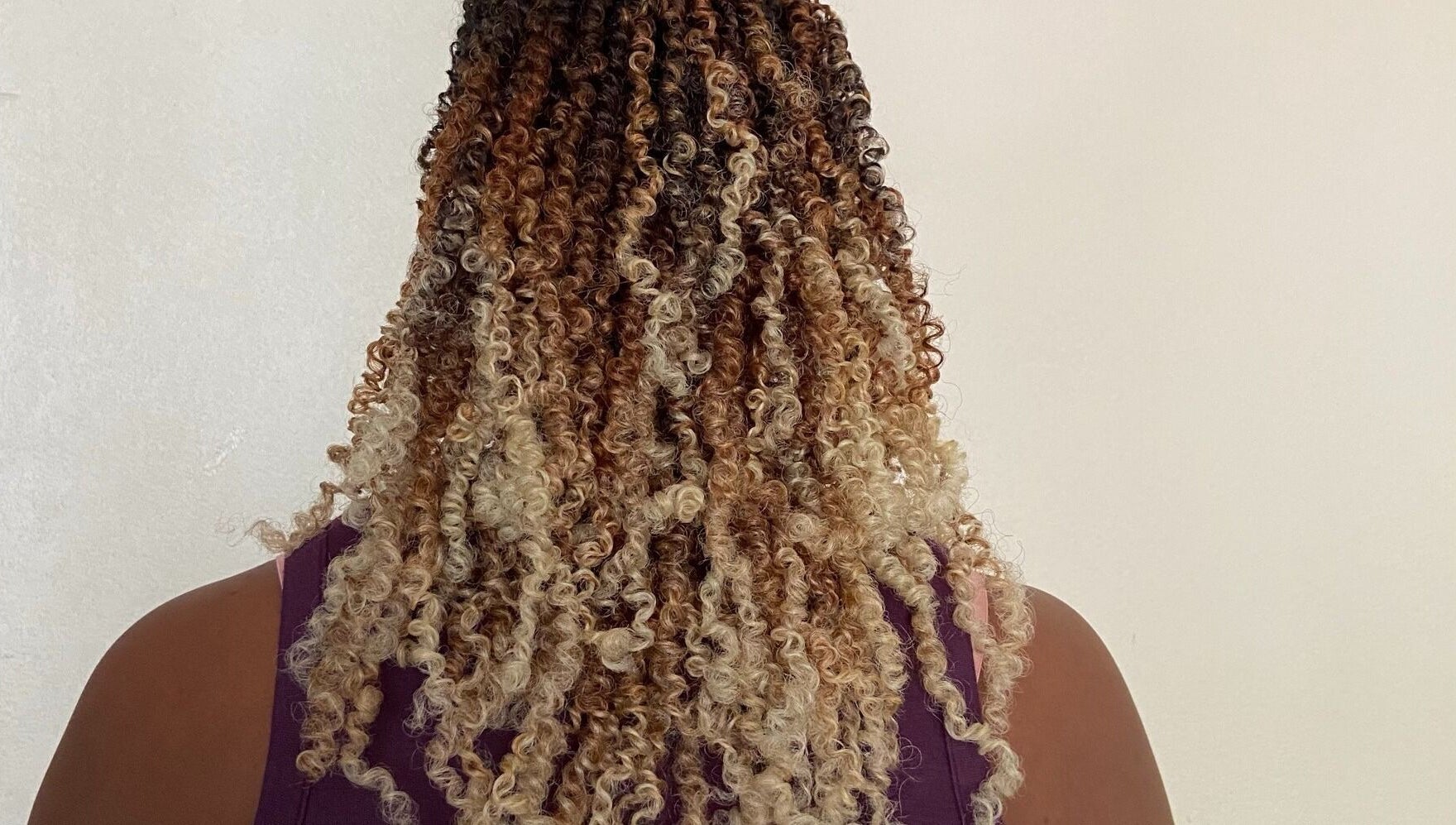 Beautiful curly hairstyle at Diamond Crochet - Nassau, Bahamas, showcasing intricate braids. Nassau, New Providence, BS.