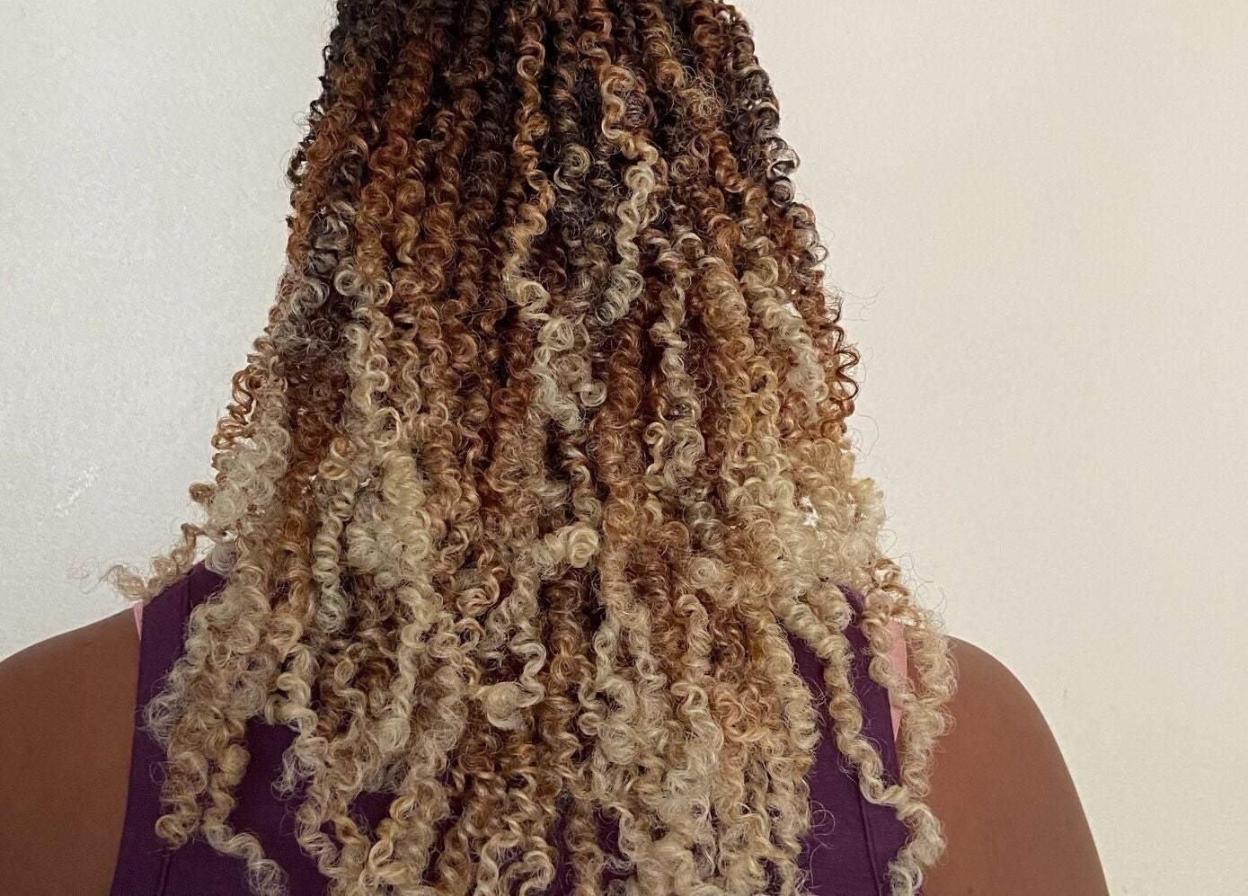 Beautiful curly hairstyle at Diamond Crochet - Nassau, Bahamas, showcasing intricate braids. Nassau, New Providence, BS.