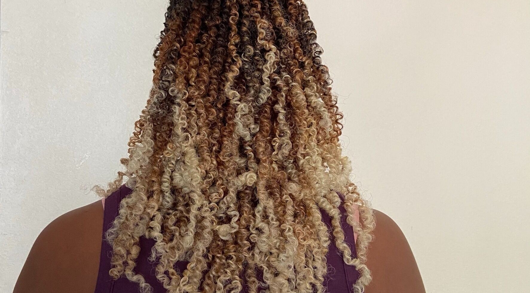Beautiful curly hairstyle at Diamond Crochet - Nassau, Bahamas, showcasing intricate braids. Nassau, New Providence, BS.
