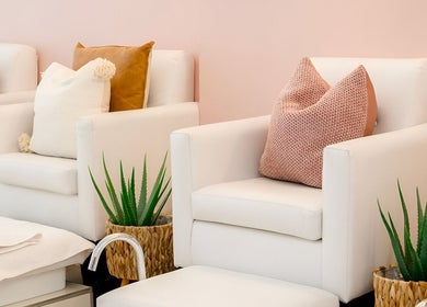 Relaxing white spa chairs at The Glam Bar, Hair, Nails, Skin, Lash Beauty Bar in Cape Town, Western Cape, ZA.
