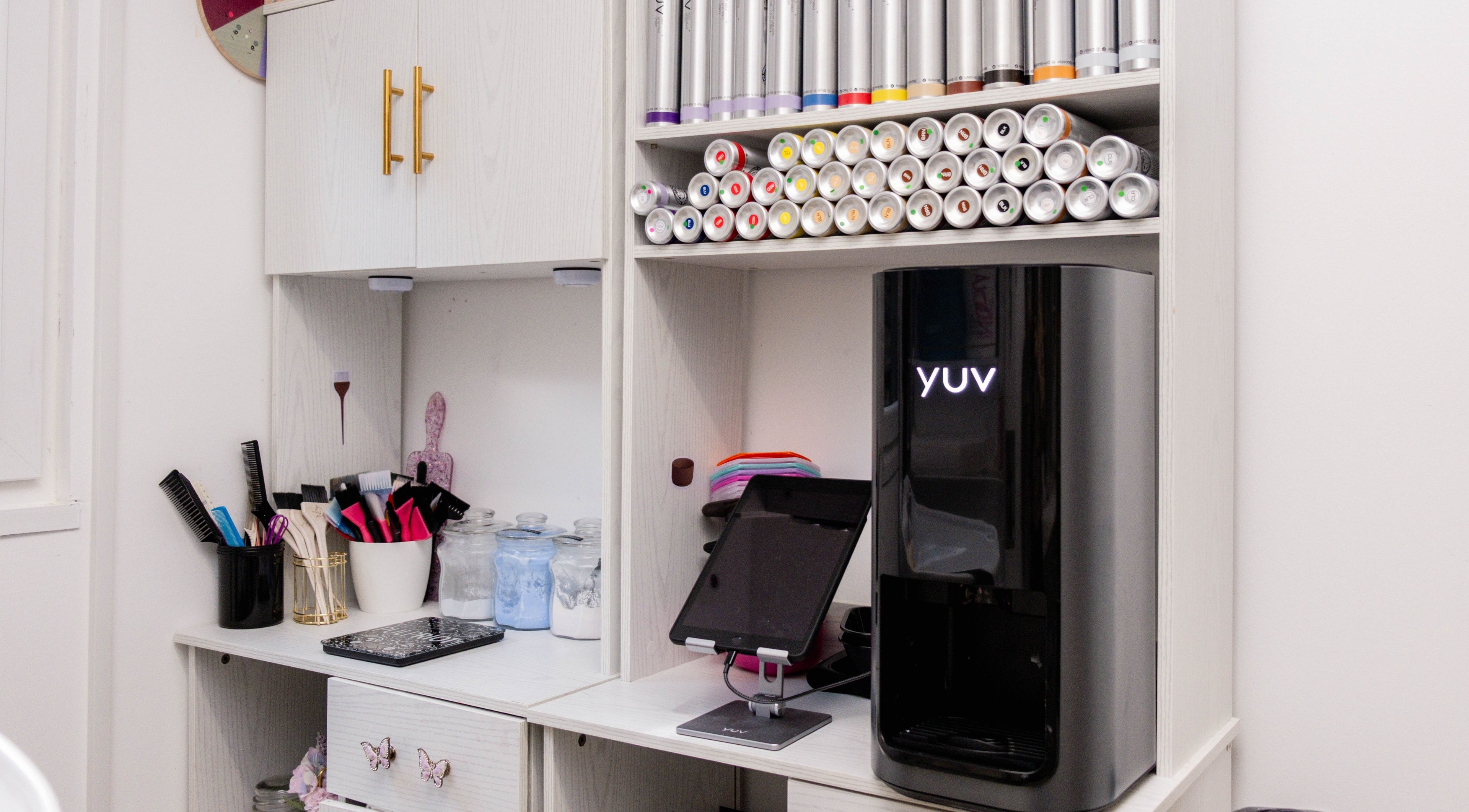 Fededamians - Fhairy Studio's modern salon setup in London, England, GB, featuring sleek tools and vibrant products.
