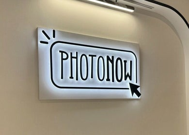 Illuminated Photonow sign at Centrepoint, Singapore, Singapore, SG, welcoming visitors with its sleek design.