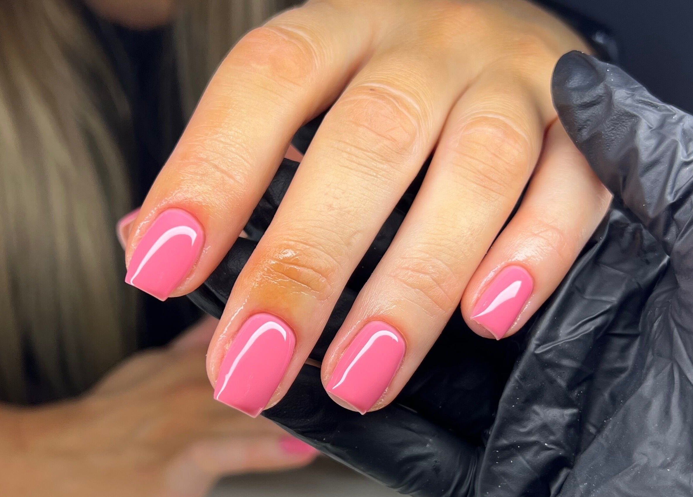 Close-up of pink manicured nails at Byleahhm, Osgodby, England, GB, showcasing professional nail care.