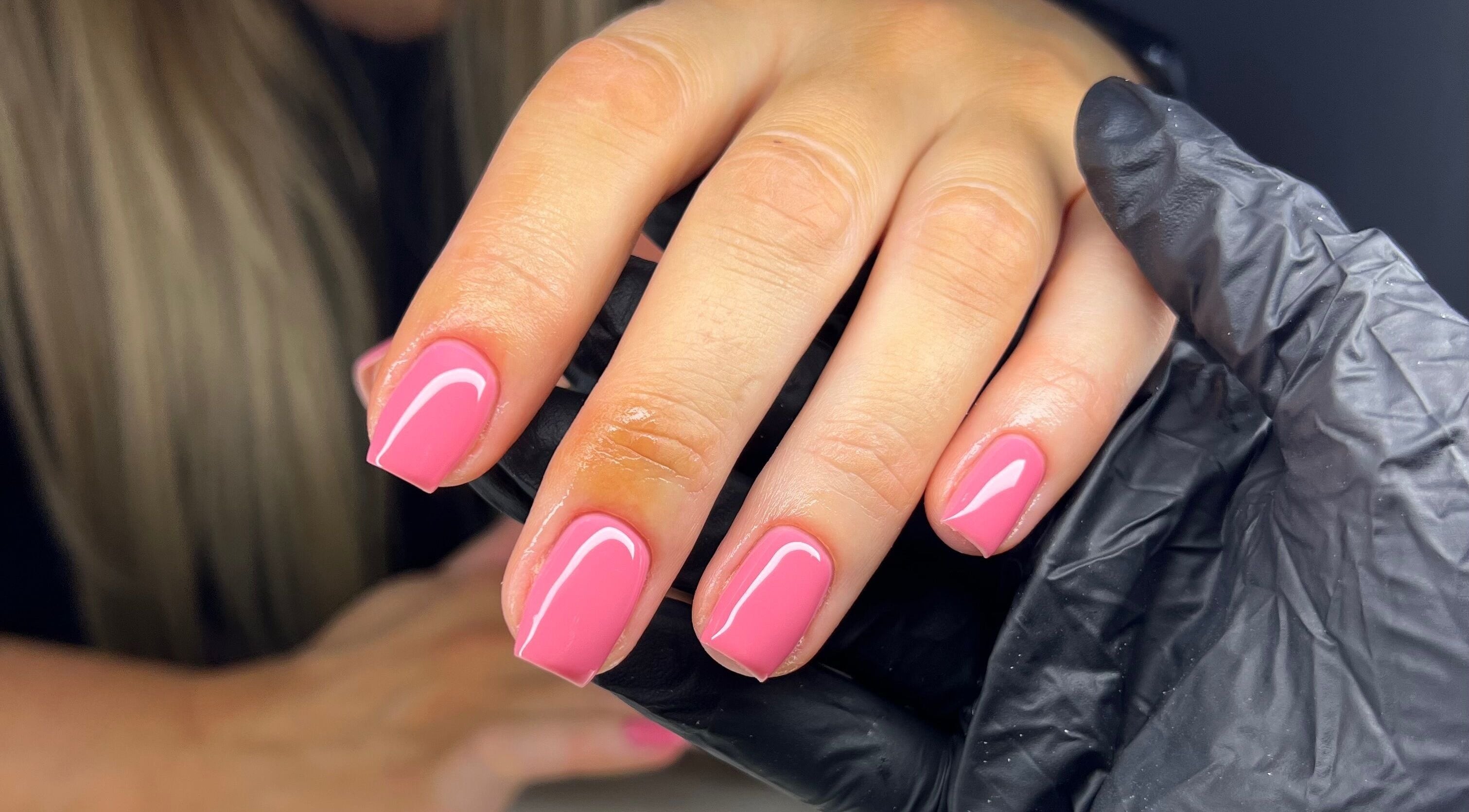 Close-up of pink manicured nails at Byleahhm, Osgodby, England, GB, showcasing professional nail care.