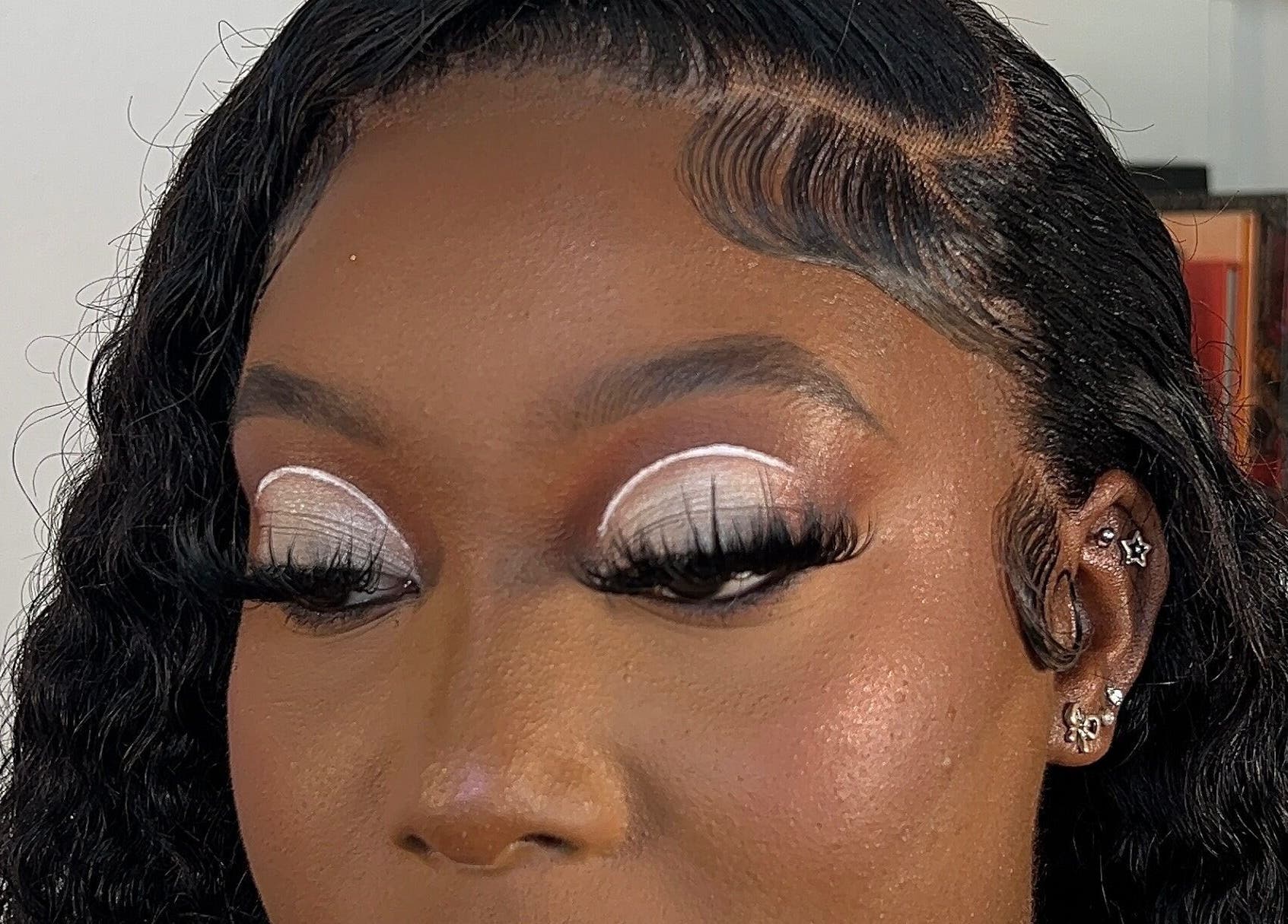 Elegant eye makeup at Facebydrea, Kingston, St. Andrew Parish, JM with bold lashes and intricate design.