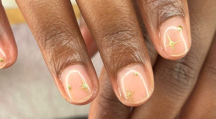 Elegant nail art with gold accents at The Lab ltd, London, England, GB. Perfect manicure for a chic look.
