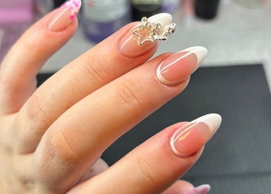 Close-up of elegant nail art with star design at The Lab ltd, London, England, GB.
