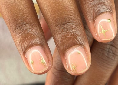 Elegant gold star nail art at The Lab ltd, London, England, GB.