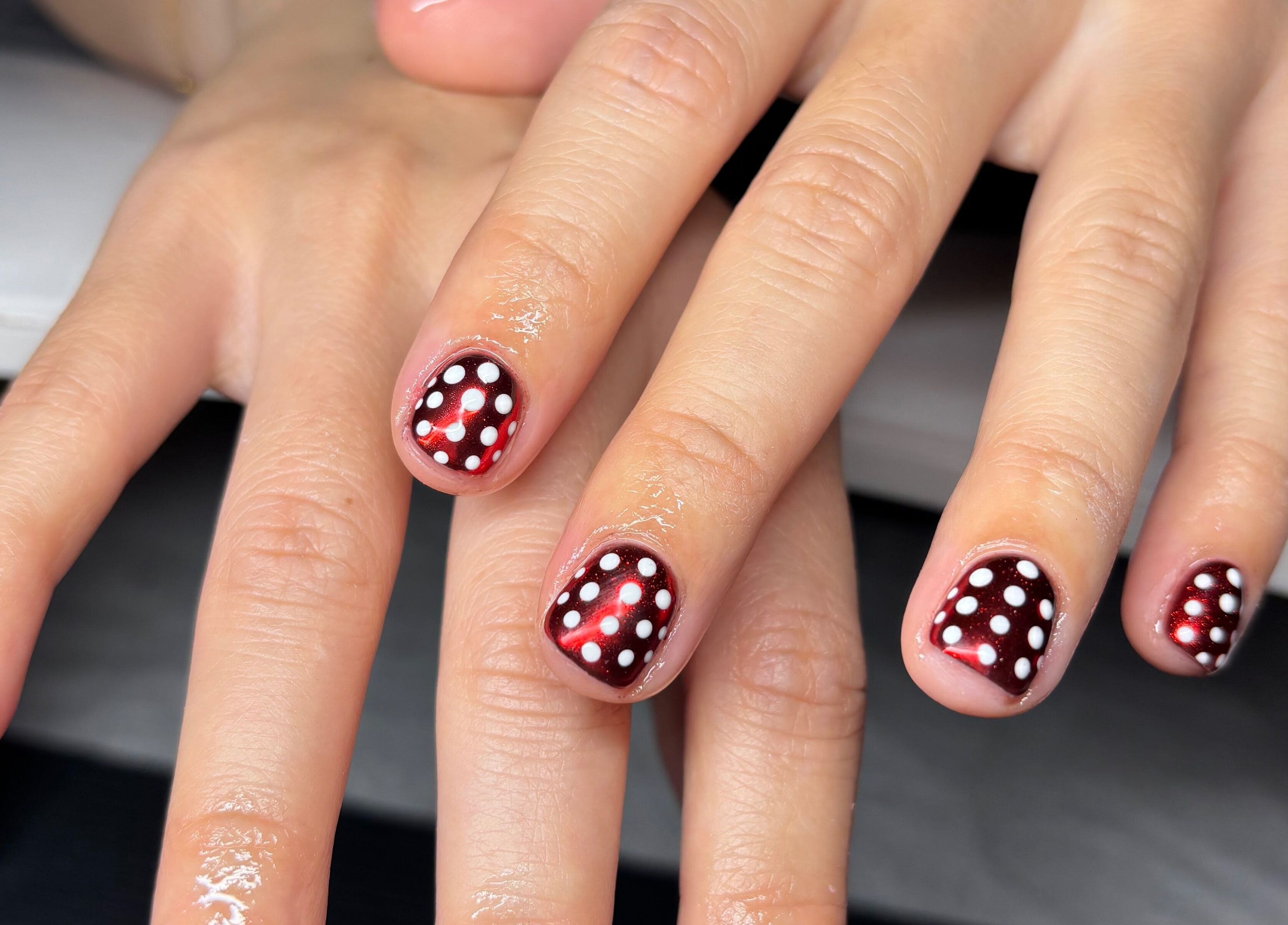 Stylish polka dot nail art at The Lab ltd, London, England, GB. Perfect for trendy beauty enthusiasts.