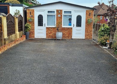 Inviting entrance to R&R Beauty, Horsforth, England. A tranquil setting with lush greenery.