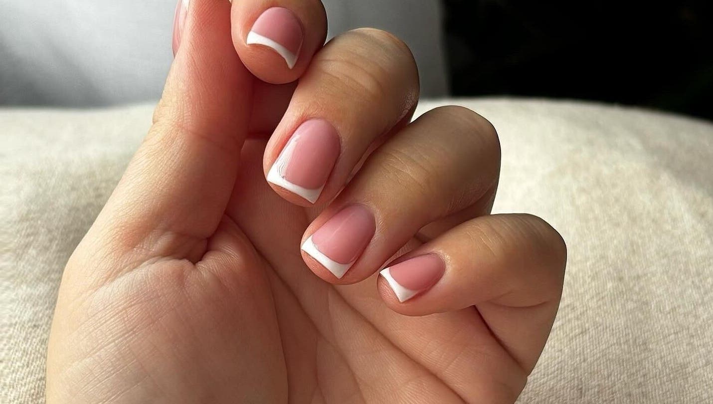 Elegant French manicure at Beauty Haven by Jodie, Caerphilly, Wales, GB, showcasing perfect styling.