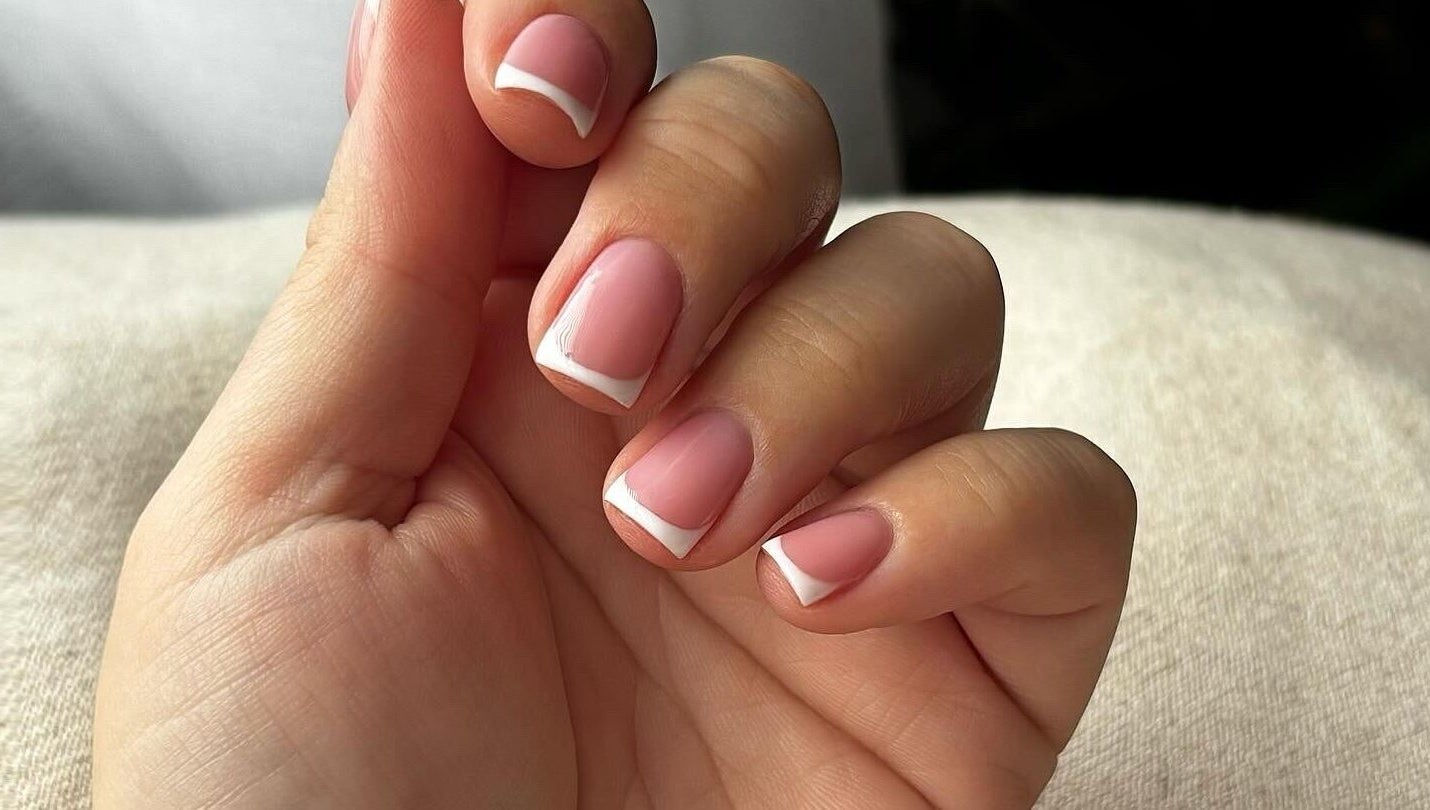 Elegant French manicure at Beauty Haven by Jodie, Caerphilly, Wales, GB, showcasing perfect styling.