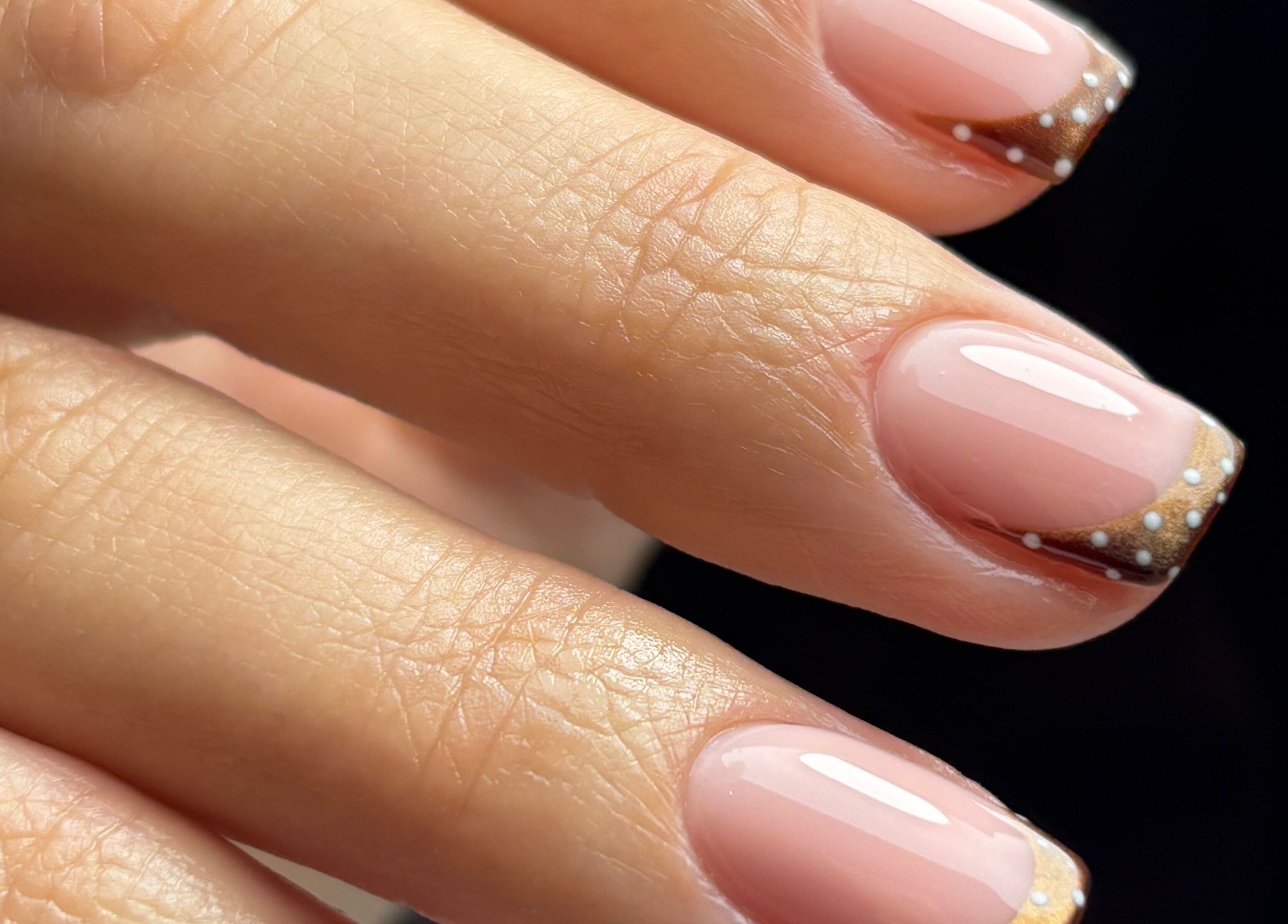Elegant nail art with brown French tips at Beauty Haven by Jodie, Caerphilly, Wales, GB.