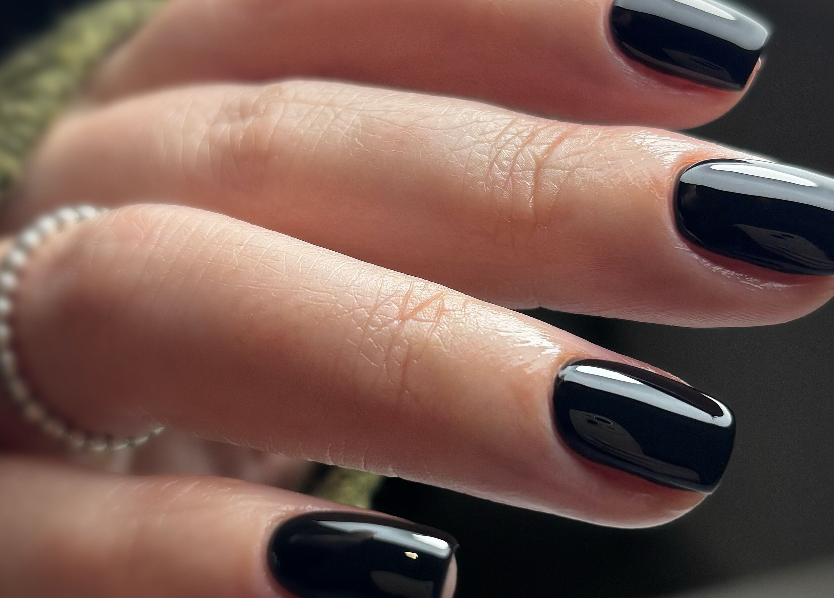 Sleek black manicure at Beauty Haven by Jodie in Caerphilly, Wales, GB, showcasing modern nail artistry.