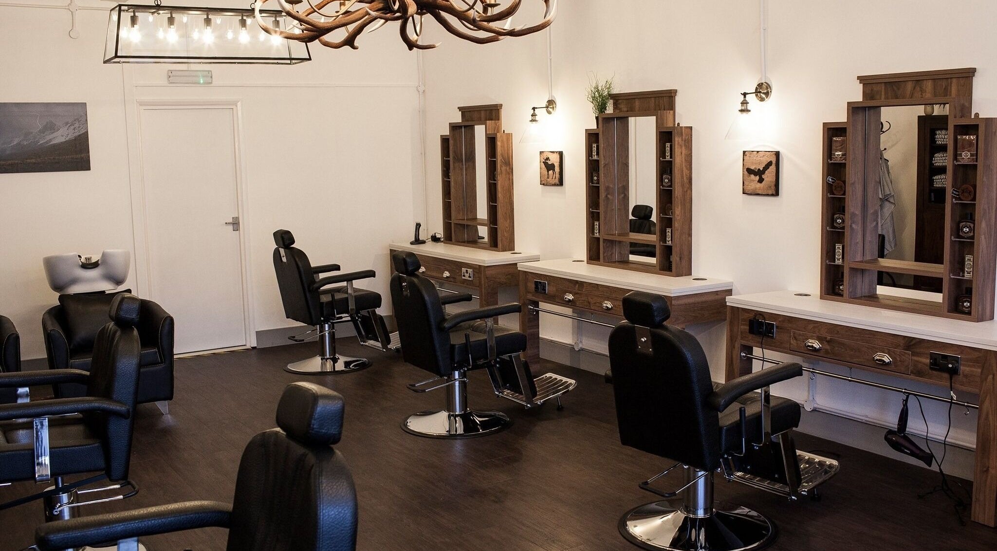 Interior of Grizzly's Hair Salon Horsham, featuring stylish stations and sleek chairs in Horsham, England, GB.