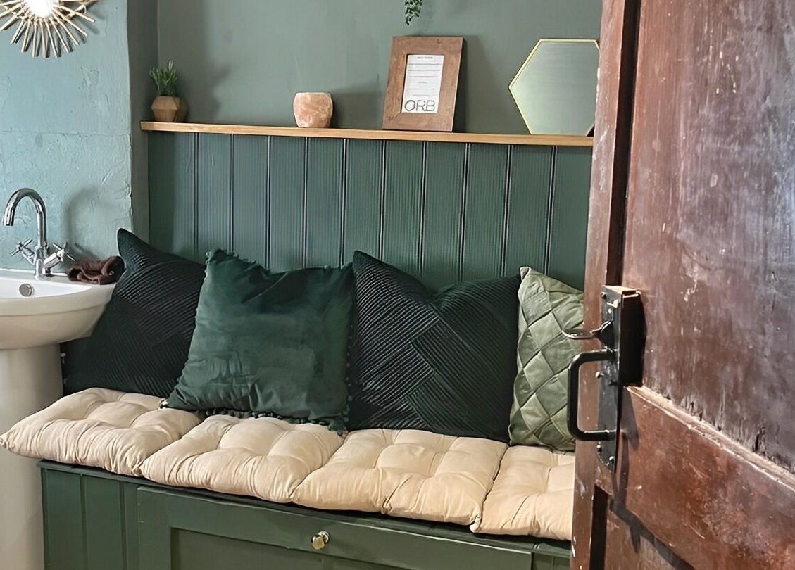 Inviting seating and sink at Orb Retreat, Uppingham, England, GB. Relaxing, cozy interior decor.