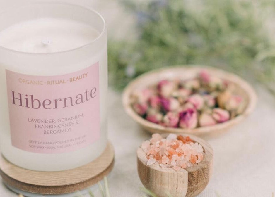 Candle with lavender and pink salt at Orb Retreat, Uppingham, England, GB for a soothing wellness experience.