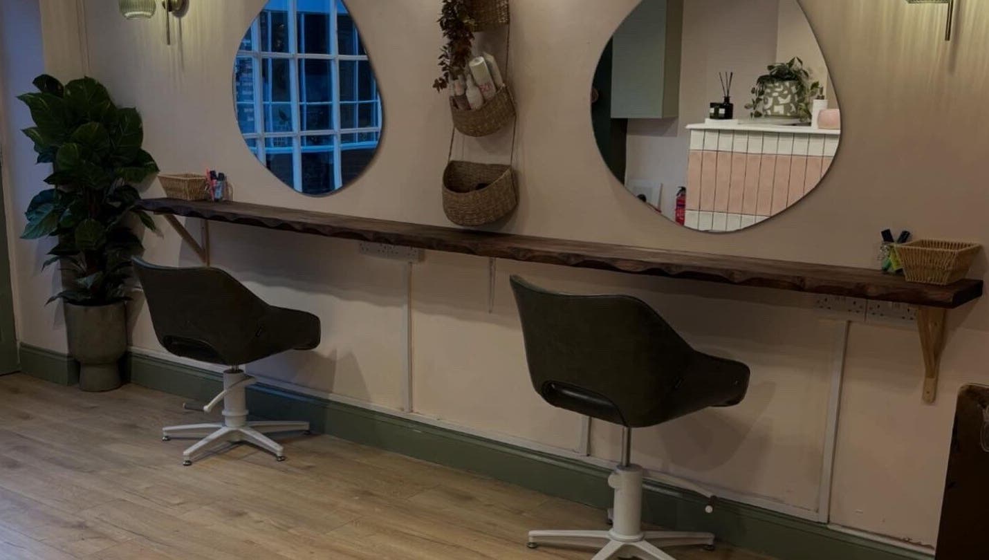 Modern salon chairs at Nicole at Sage and Blush, Grantham, England, GB with stylish decor and mirrors.