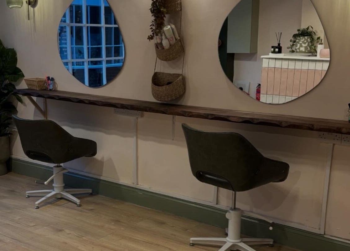 Modern salon chairs at Nicole at Sage and Blush, Grantham, England, GB with stylish decor and mirrors.
