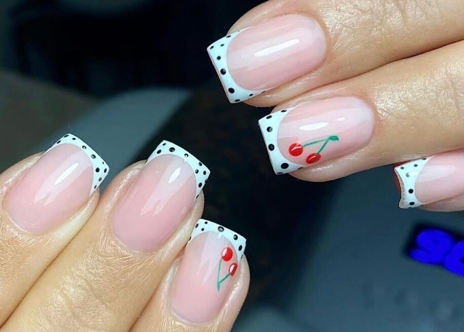 Cherry-themed French manicure at Poise Studio, Rawmarsh, England, GB showcasing detailed nail art.
