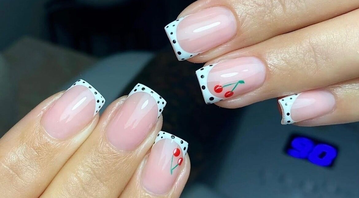 Cherry-themed French manicure at Poise Studio, Rawmarsh, England, GB showcasing detailed nail art.