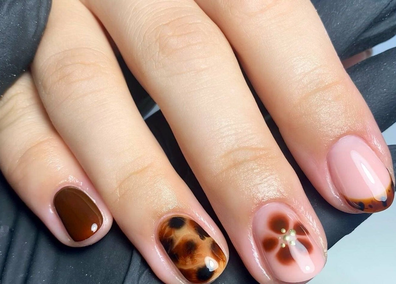 Stylish nail art at Poise Studio, Rawmarsh, England, GB showcasing intricate designs.