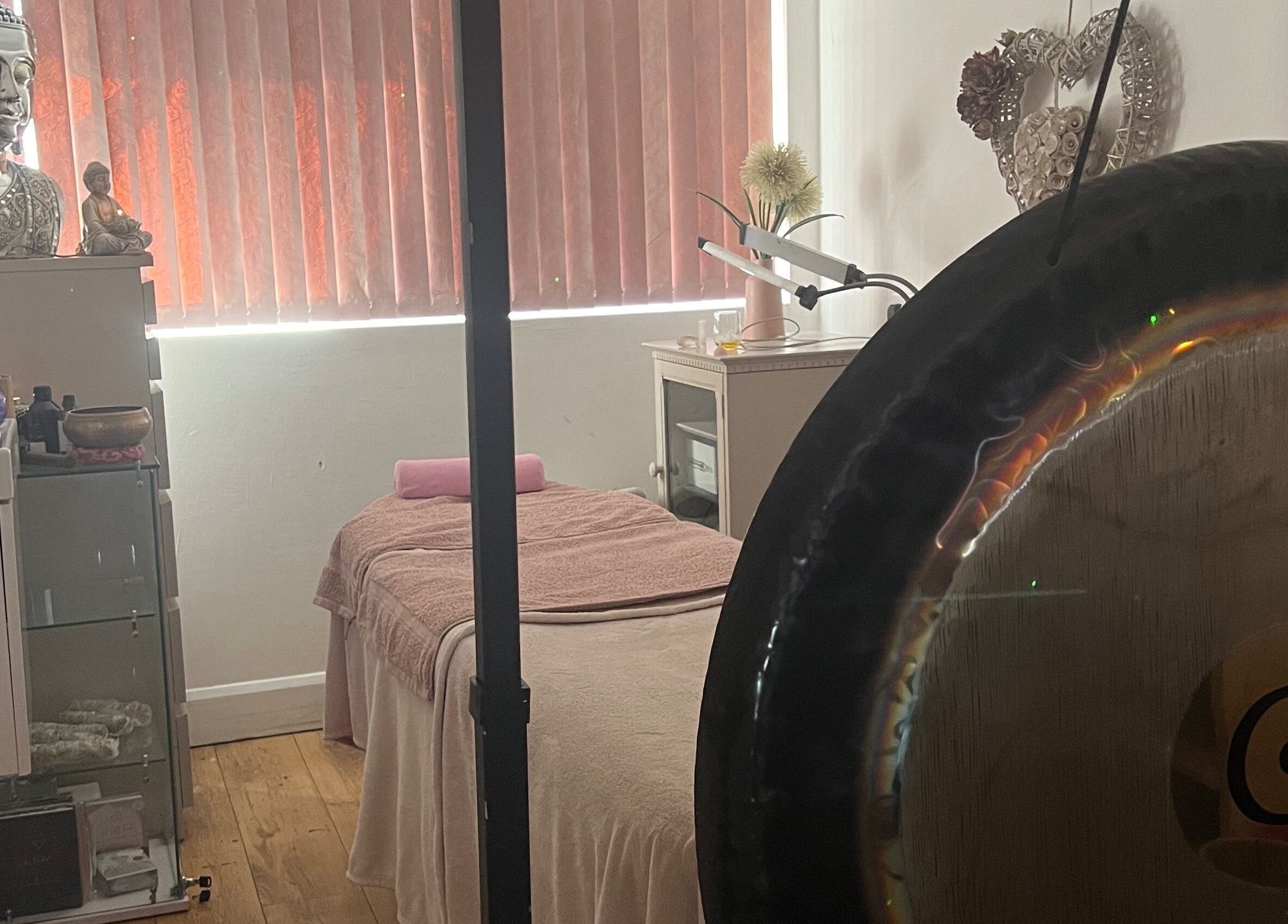 Relaxing massage suite at Eternal by Adriana, Prenton, England, GB with gong and serene decor.