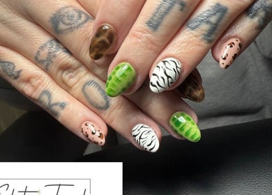 Creative animal print nail art at Elite Touch, Fleetwood, England, GB. Showcasing unique designs and colors.