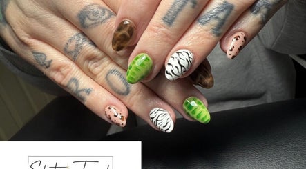 Creative animal print nail art at Elite Touch, Fleetwood, England, GB. Showcasing unique designs and colors.