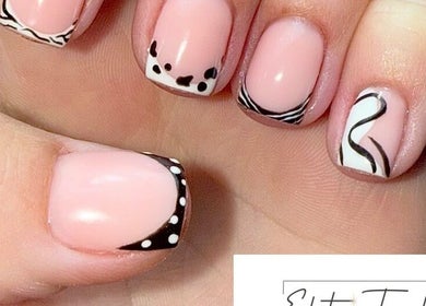 Elegant nail art with black and white designs at Elite Touch, Fleetwood, England, GB.