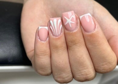 Elegant nail art featuring starfish design at Elite Touch, Fleetwood, England, GB.