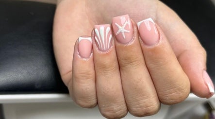 Elegant nail art featuring starfish design at Elite Touch, Fleetwood, England, GB.