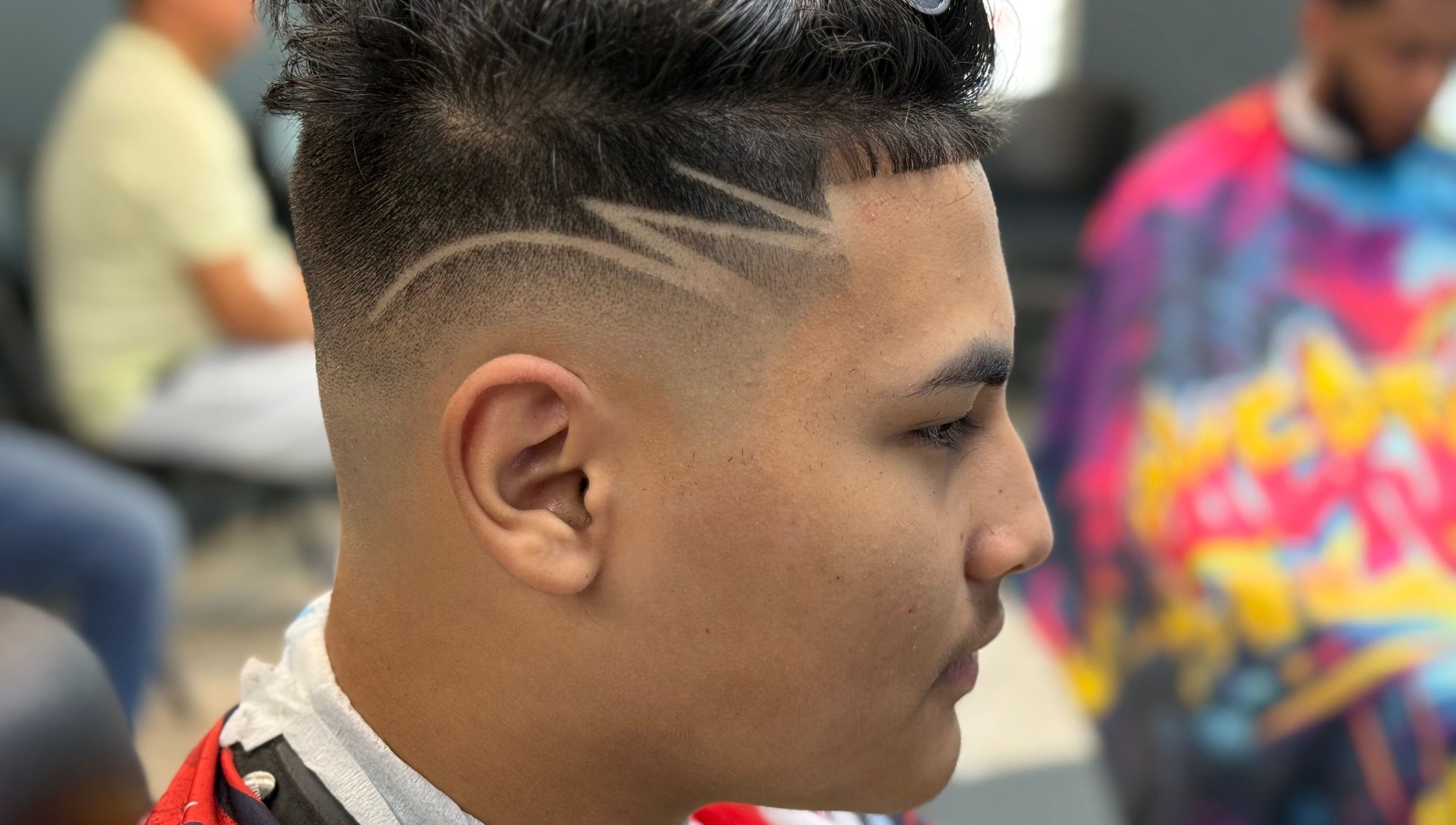 Close-up of a trendy haircut with unique designs at Polanco Barber, Humacao, Humacao, PR.