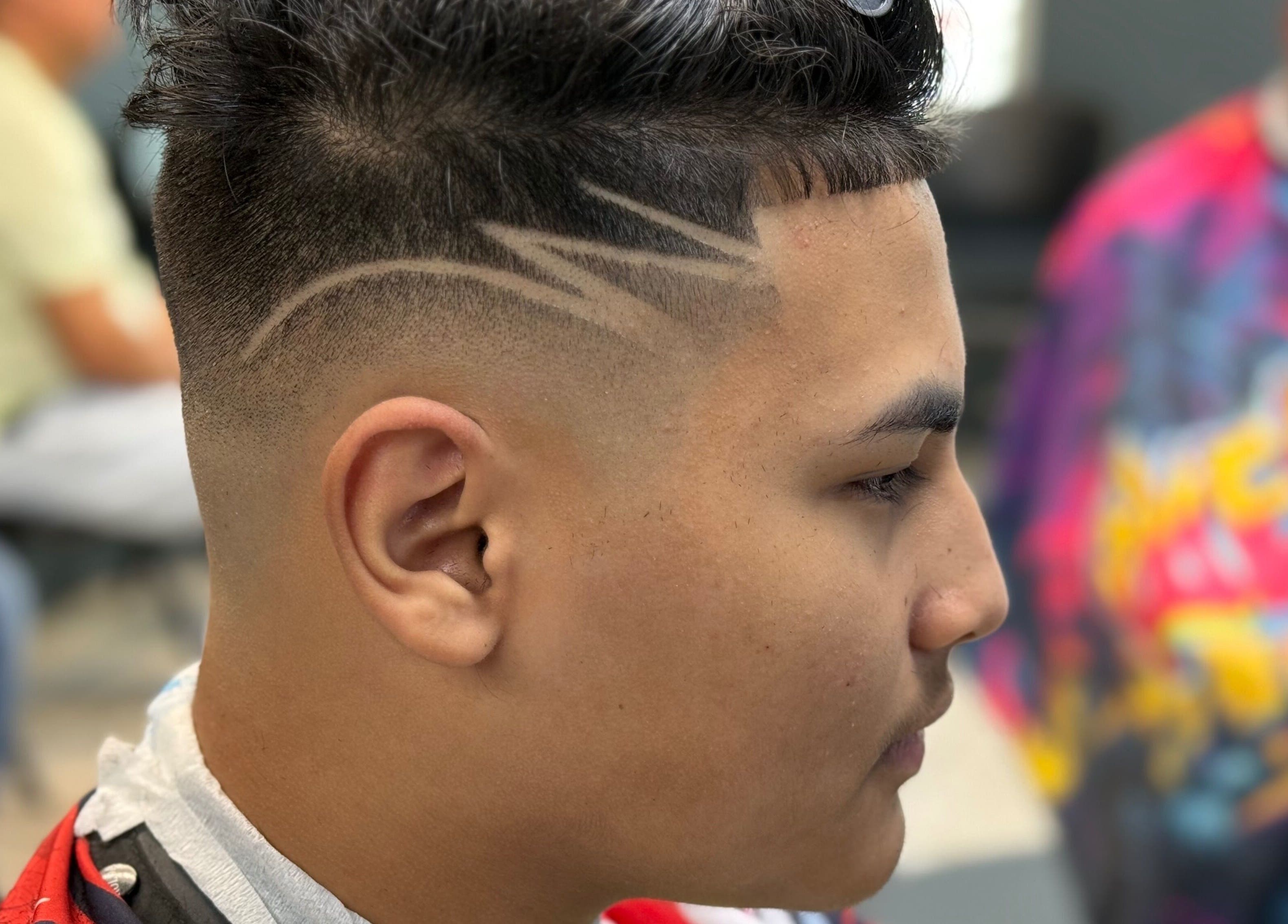 Close-up of a trendy haircut with unique designs at Polanco Barber, Humacao, Humacao, PR.