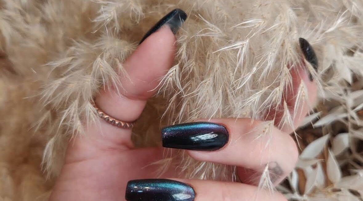 Chic dark nail art at Bombshell Beauty Malta - Nail Bar 1, Tas-Sliema, MT surrounded by pampas grass.