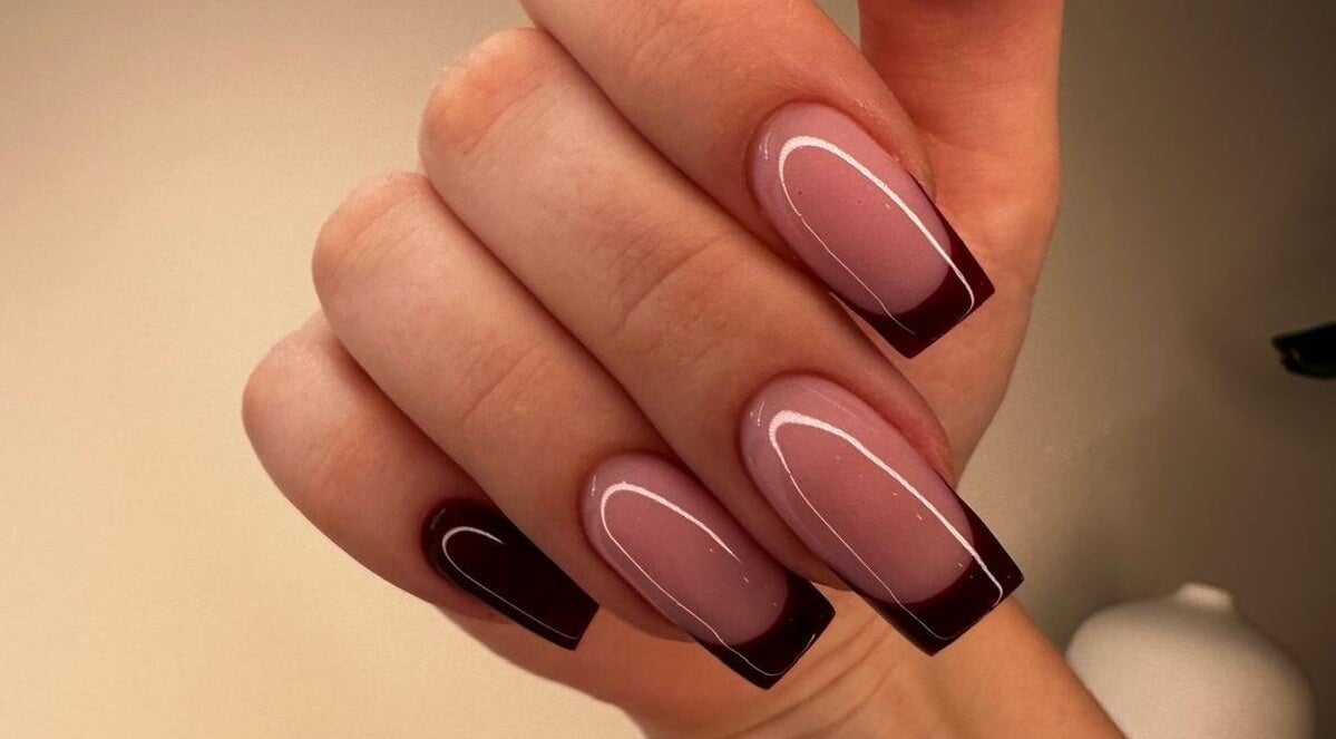 Elegant manicured nails with burgundy tips at Bombshell Beauty Malta @ HAIR.COM, Is-swieqi, MT.