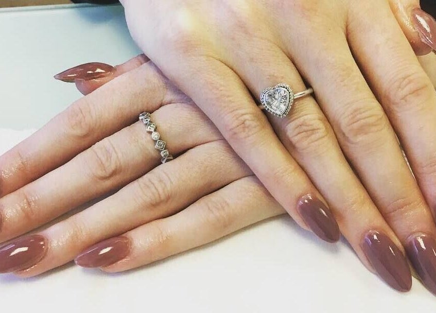 Stylishly manicured hands with rings at Bay Beauty Academy in Whitley Bay, England, GB.
