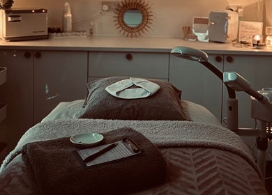 Tranquil massage room at CALM with Clare, Connah's Quay, Wales, GB, featuring a cozy treatment bed and calming decor.