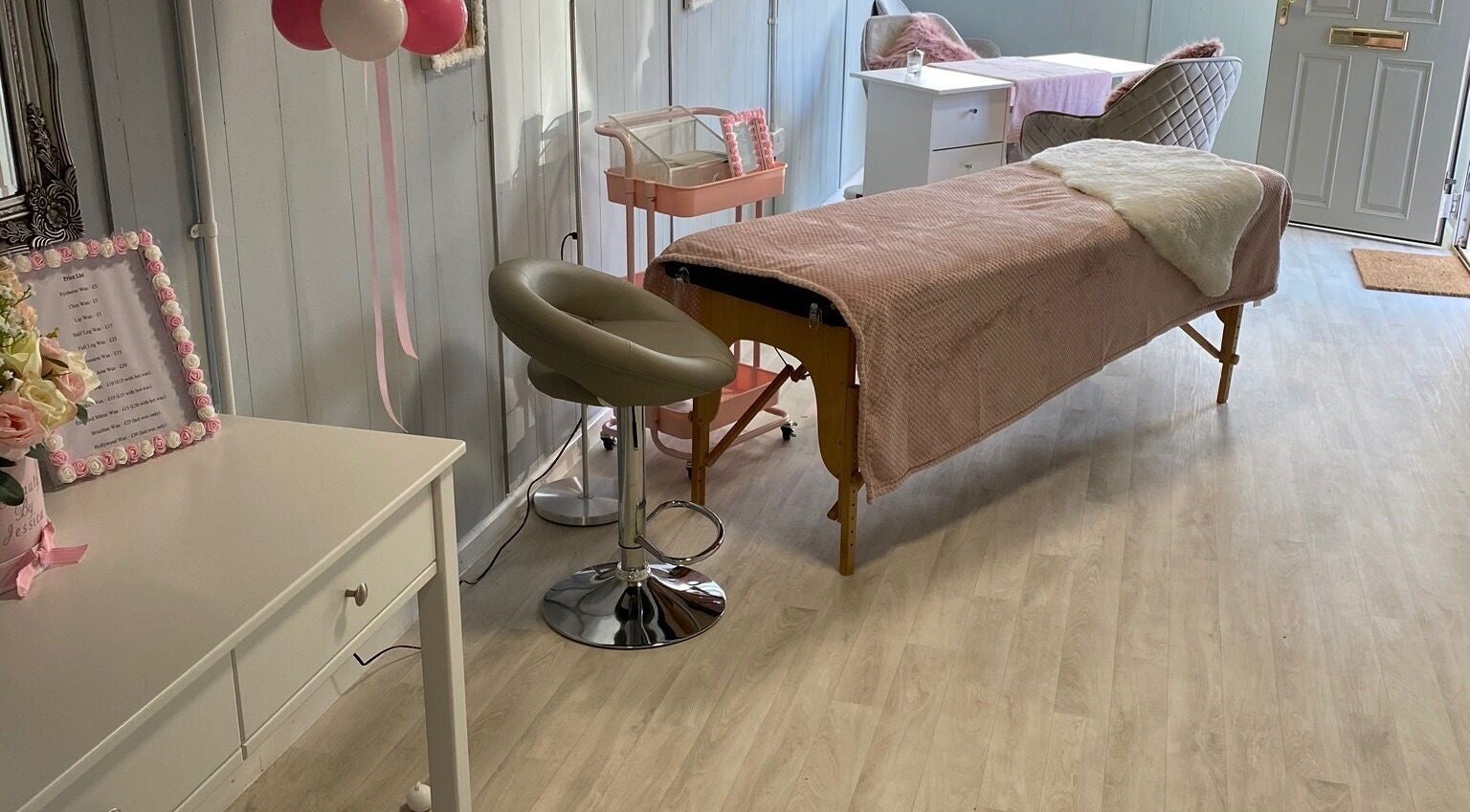 Relaxing spa room at Beauty by Jessica in Godalming, England, GB featuring a treatment bed and decor.