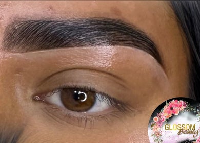 Perfectly shaped eyebrow at Glossom Beauty, Motherwell, Scotland, GB, showcasing expert styling techniques.