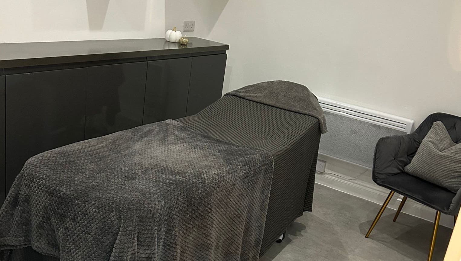 Relaxing treatment room at Be Beautiful by Alex, Glenfield, England, GB, with a comfortable massage bed.