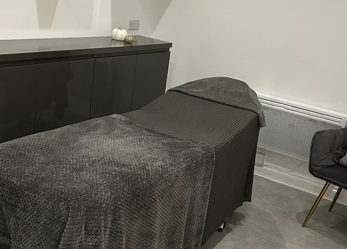 Relaxing treatment room at Be Beautiful by Alex, Glenfield, England, GB, with a comfortable massage bed.