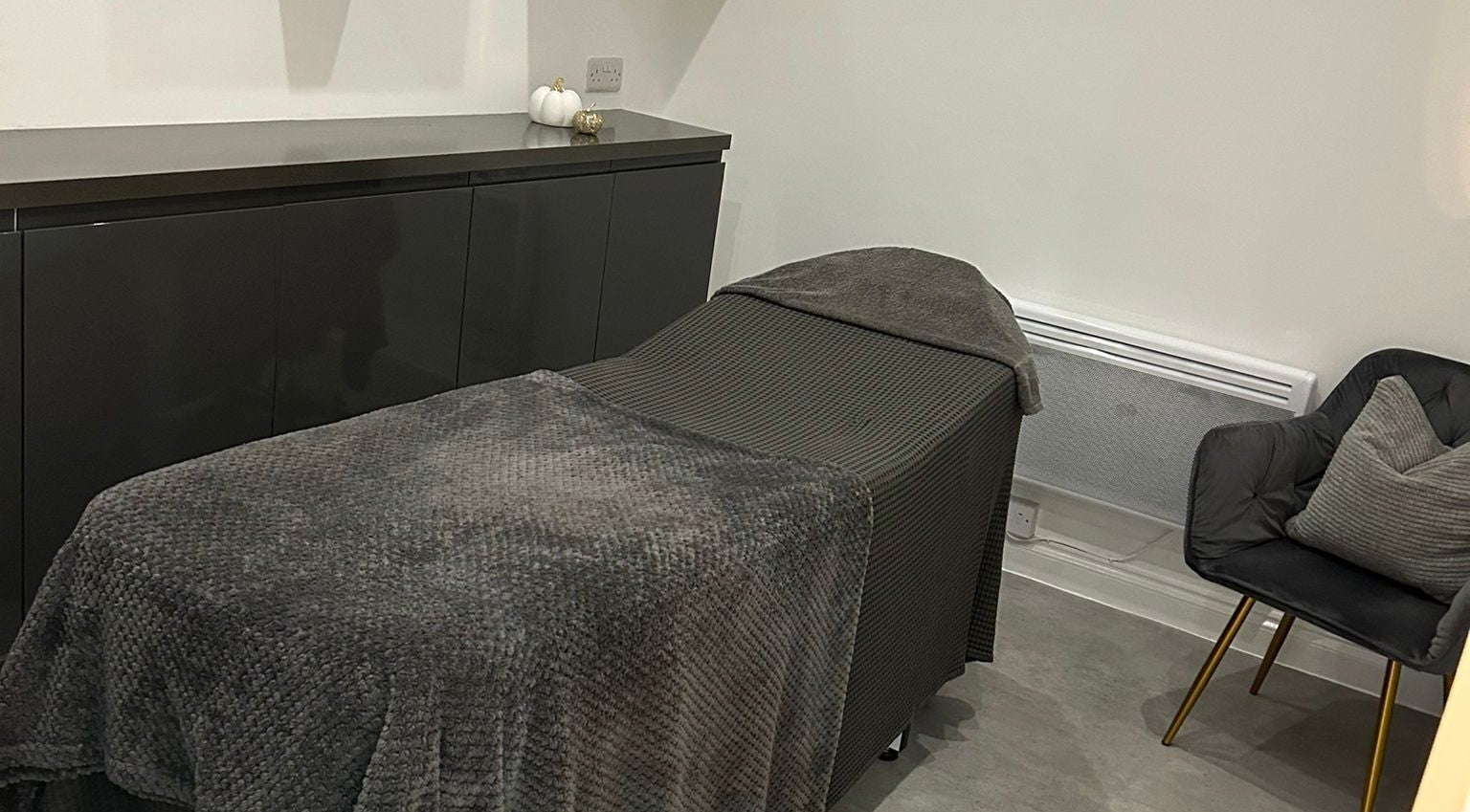 Relaxing treatment room at Be Beautiful by Alex, Glenfield, England, GB, with a comfortable massage bed.