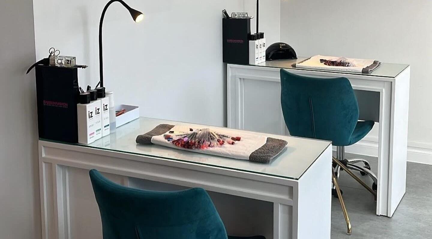 Chic nail station at Be beautiful by Alex, Glenfield, England, GB. Modern design with teal chairs and manicure tools.