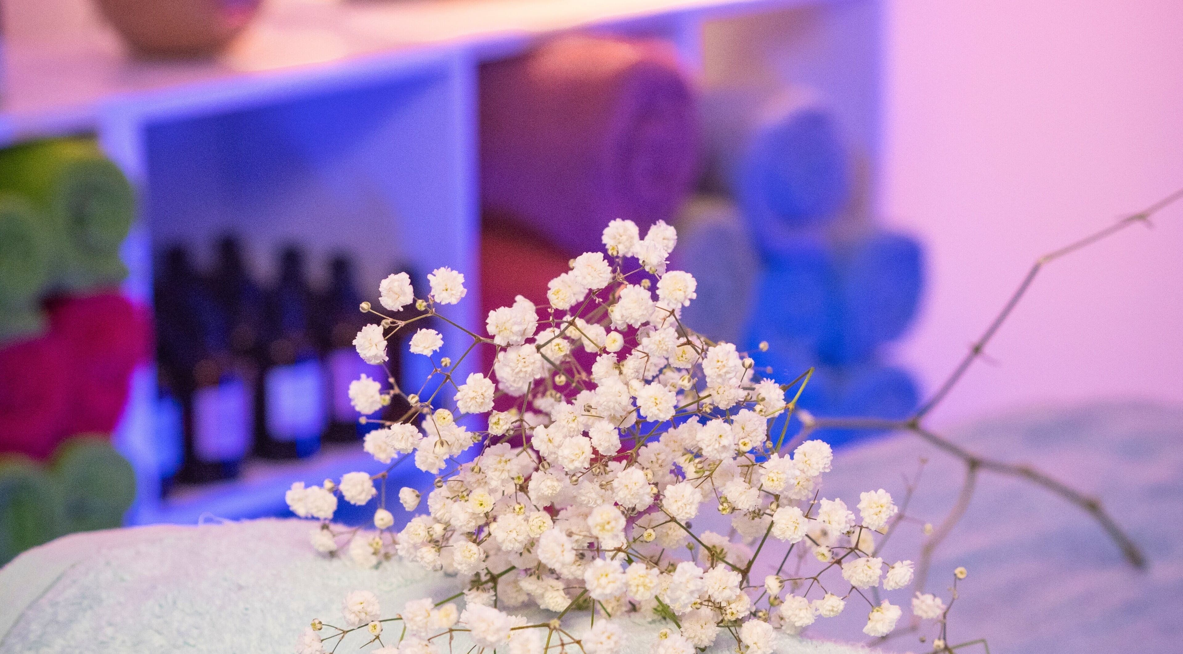 Delicate white flowers on a massage table at Healer Massage in Belfast, Northern Ireland, GB.
