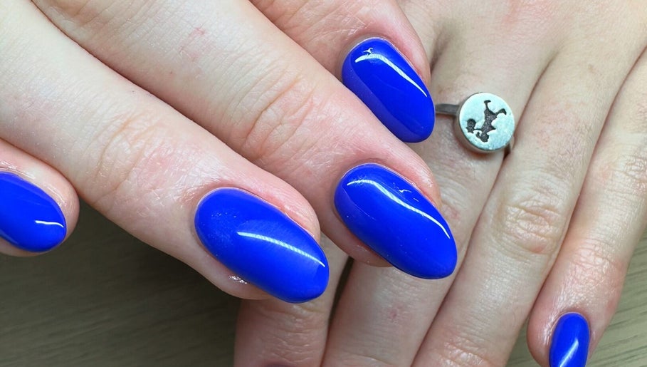 Bright blue nails manicure at The Cove - New Plymouth, enhancing beauty in New Plymouth, Taranaki, NZ.