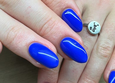Bright blue nails manicure at The Cove - New Plymouth, enhancing beauty in New Plymouth, Taranaki, NZ.